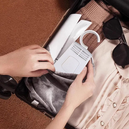 Cintre électrique pliable et portable pour le séchage des vêtements